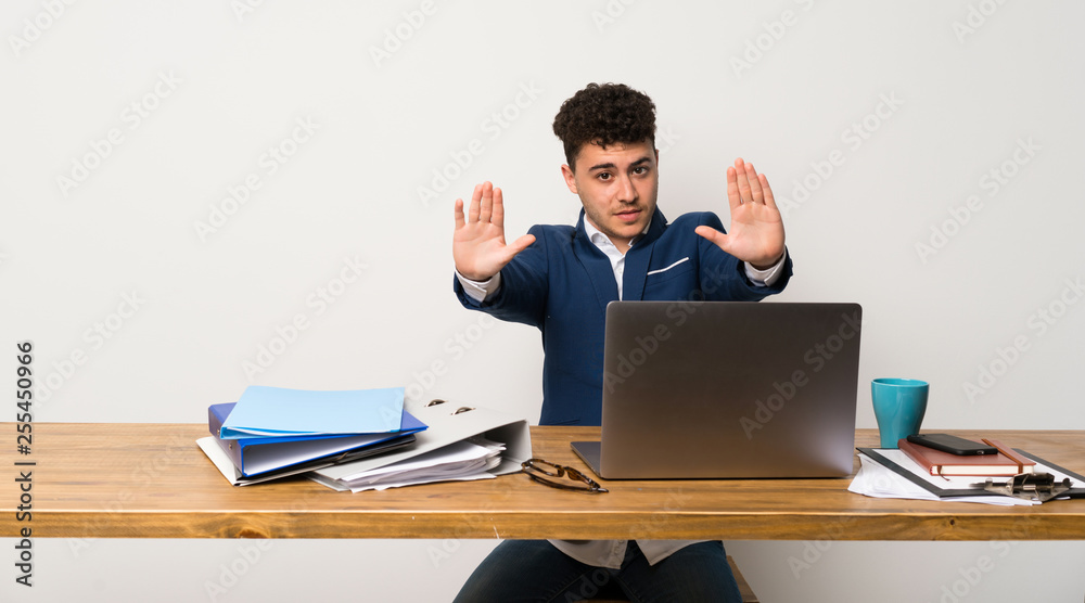 Business man in a office making stop gesture and disappointed Business man in a office making stop gesture and disappointed