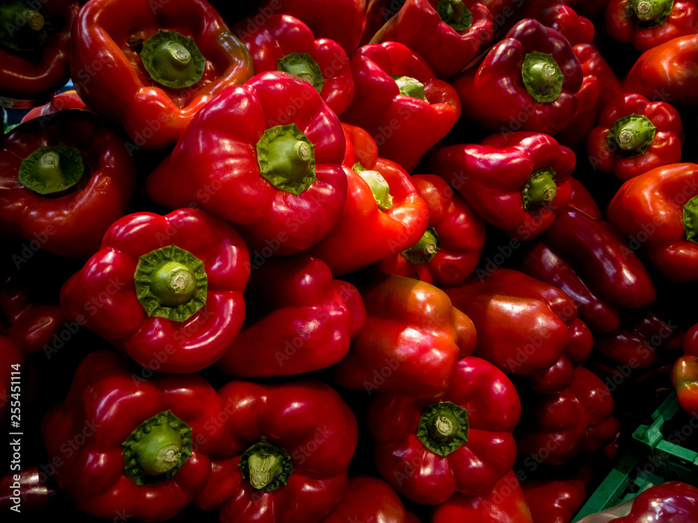 piled red peppers at market