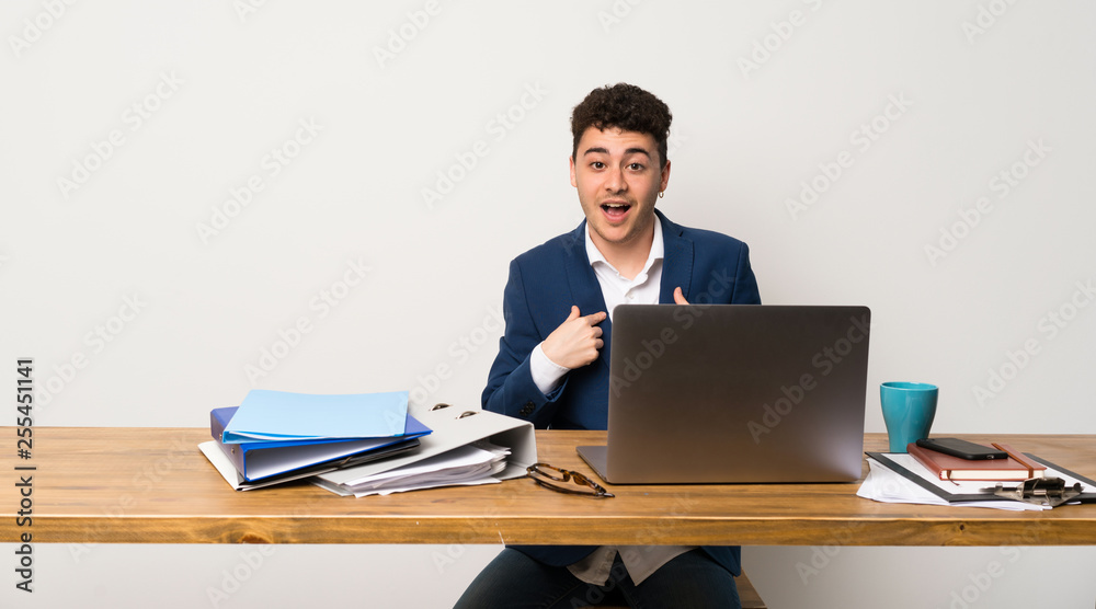 Business man in a office with surprise facial expression Business man in a office with surprise facial expression