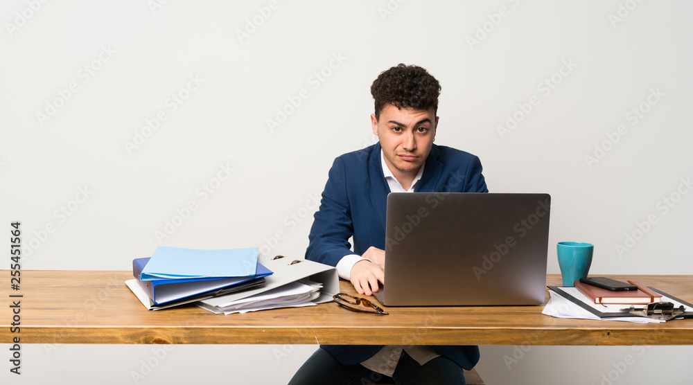 Business man in a office feeling upset Business man in a office feeling upset