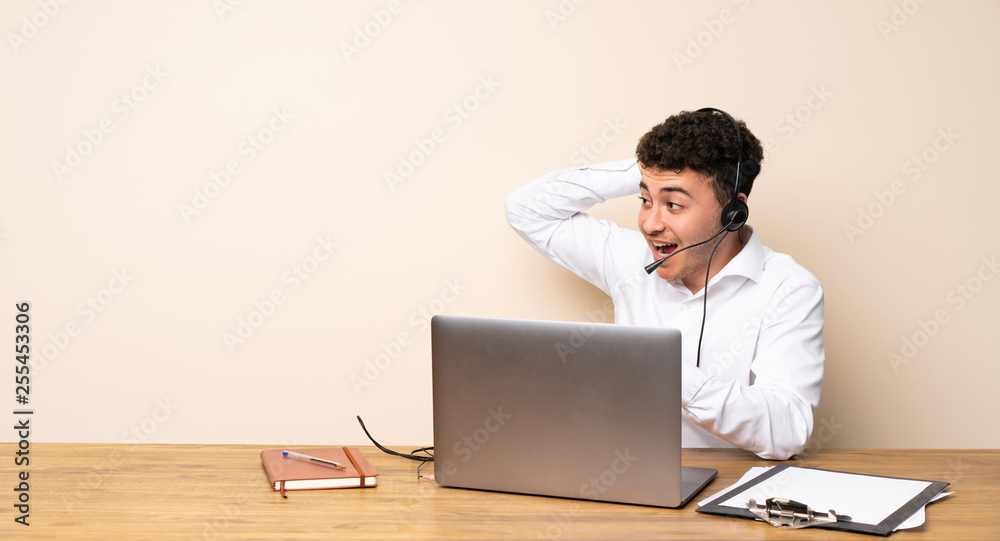 Telemarketer man surprised and pointing finger to the side Telemarketer man surprised and pointing finger to the side