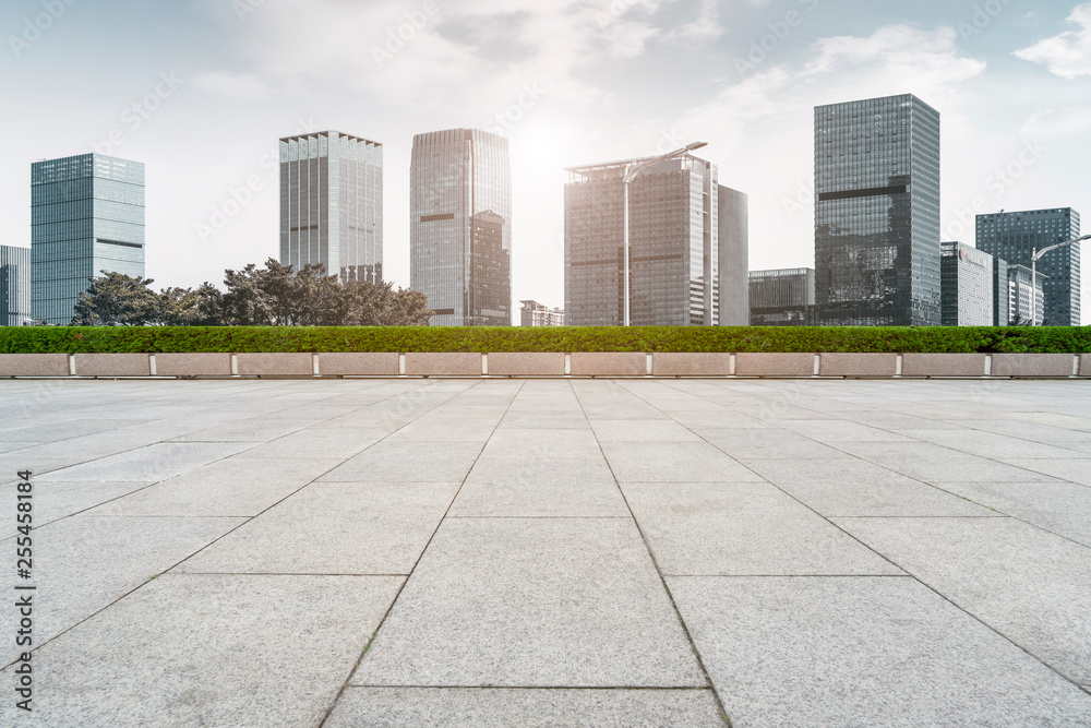 Urban skyscrapers with empty square floor tiles