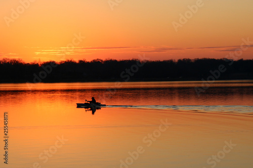 Isolated Kayak at Sunrise on the lake
