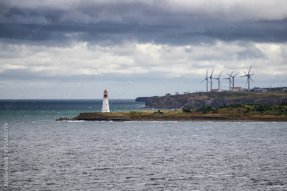 Wind Turbine on the ocean coast during a cloudy day. Taken in New Victoria, Nova Scotia, Canada. Wind Turbine on the ocean coast during a cloudy day. Taken in New Victoria, Nova Scotia, Canada.