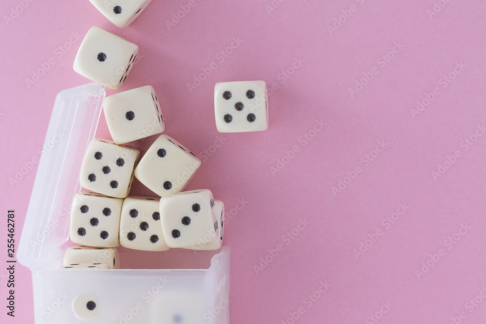White gaming dices on violet background. victory chance, lucky. Flat lay, place for text. Top view. Close-up. Concept gamble. spectacular pastel