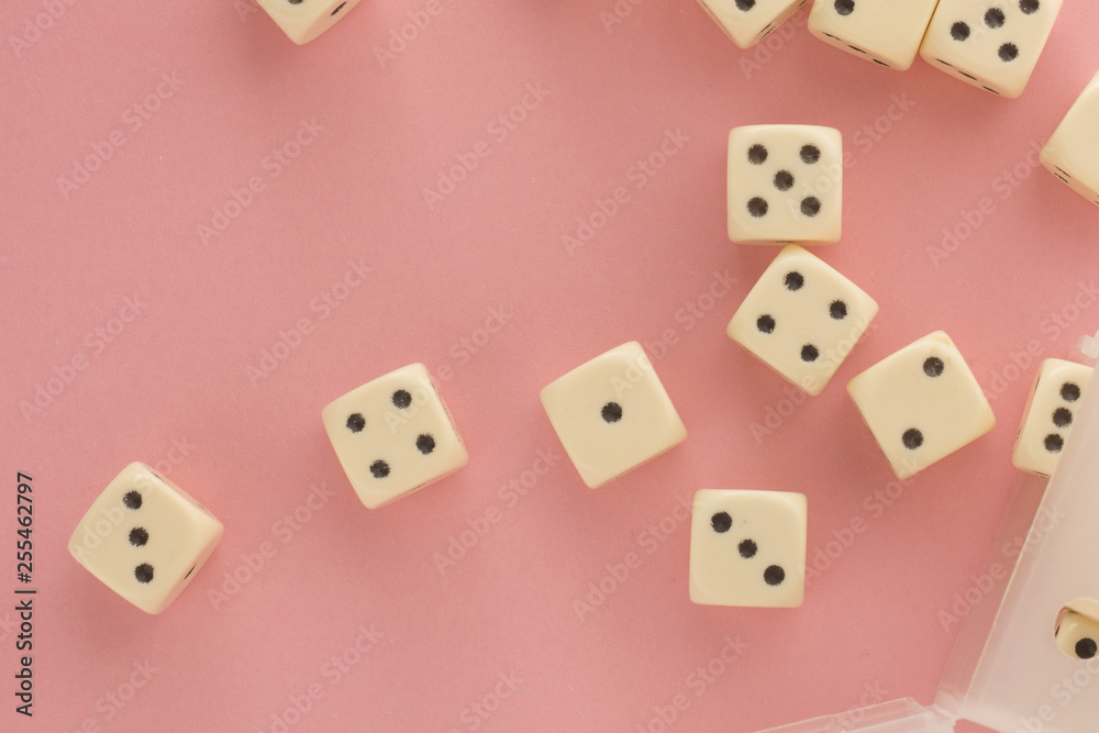 White gaming dices on pink background. victory chance, lucky. Flat lay, place for text. Top view. Close-up. Concept gamble. spectacular pastel White gaming dices on pink background. victory chance, lucky. Flat lay, place for text. Top view. Close-up. Concept gamble. spectacular pastel