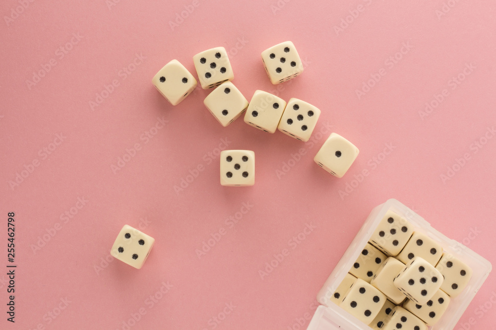 White gaming dices on pink background. victory chance, lucky. Flat lay, place for text. Top view. Close-up. Concept gamble. spectacular pastel White gaming dices on pink background. victory chance, lucky. Flat lay, place for text. Top view. Close-up. Concept gamble. spectacular pastel