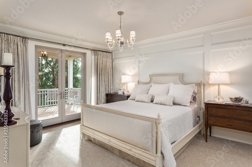 Beautiful master bedroom in new luxury traditional style home photo