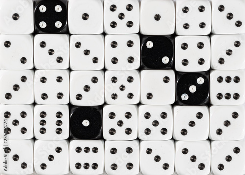 Background of random ordered white dices with four black cubes