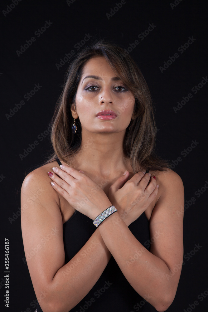 Beautiful woman with her hands crossed over her chest
