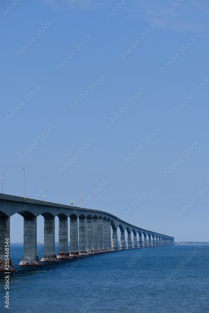 The confederation bridge spanning across  the northumberland strait to Prince Edward Island in Canada's Eastern province