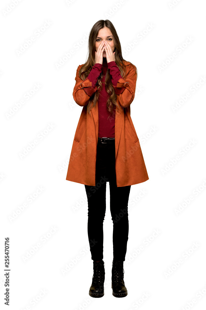 Full-length shot of Young woman with coat smiling a lot on isolated white background Full-length shot of Young woman with coat smiling a lot on isolated white background