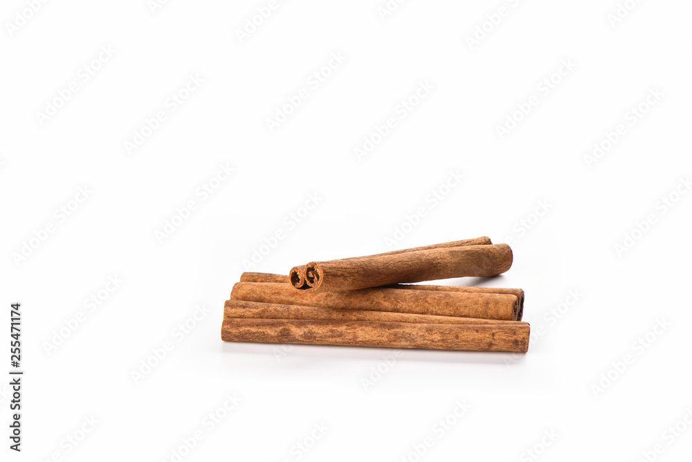 A few cinnamon sticks isolated on white background. Spice concept.