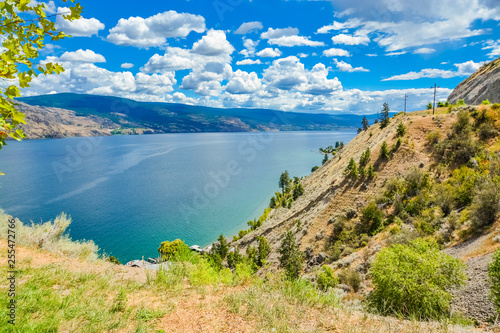 Beautiful view on Okanagan lake and mountains from the shore