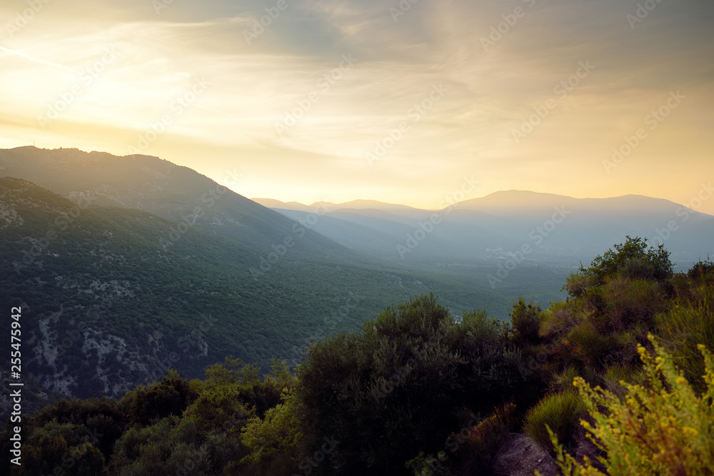 Scenic view of magnificent mountains on cloudy autumn sunset on Kefalonia. Cephalonia, Greece. Scenic view of magnificent mountains on cloudy autumn sunset on Kefalonia. Cephalonia, Greece.