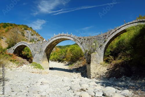 Plakidas arched stone bridge of Zagori region in Northern Greece. Iconic bridges were mostly built during the 18th and 19th centuries by local master craftsmen using local stone.