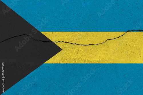 bahamas flag on concrete wall with crack