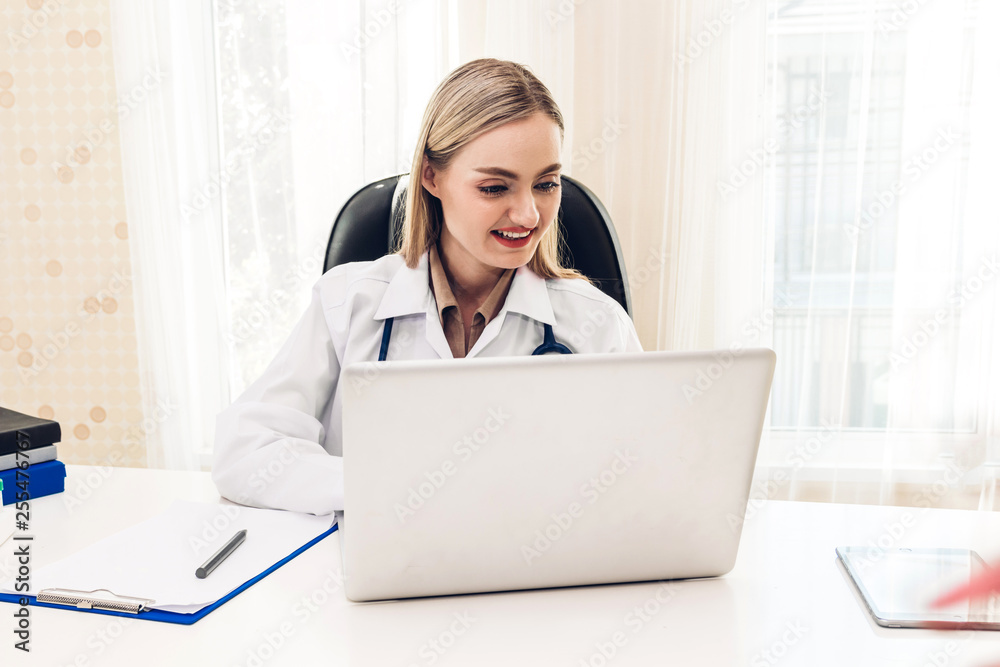 Doctor and stethoscope working with laptop computer in hospital.healthcare and medicine Doctor and stethoscope working with laptop computer in hospital.healthcare and medicine