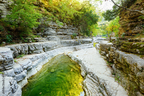 Papingo Rock Pools, also called ovires, natural green water pools located in small smooth-walled gorge near the village of Papingo in Zagori region, Greece. photo