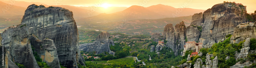 Panoramic view of Meteora valley, a rock formation in central Greece hosting one of the largest complexes of Eastern Orthodox monasteries, built on immense natural pillars.