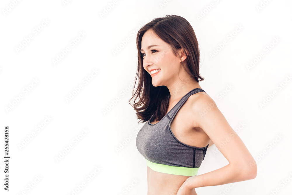 Sport woman in sportswear relax stand after workout against copy space for adding text with white wall background.Diet concept.Fitness and healthy lifestyle Sport woman in sportswear relax stand after workout against copy space for adding text with white wall background.Diet concept.Fitness and healthy lifestyle