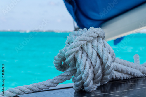 closeup on sailing rope. detail shot on coiled rope ready to set sail © victoria