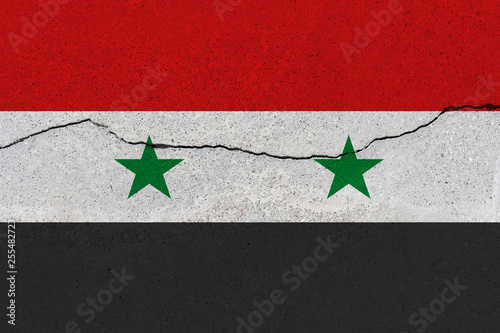 syria flag on concrete wall with crack