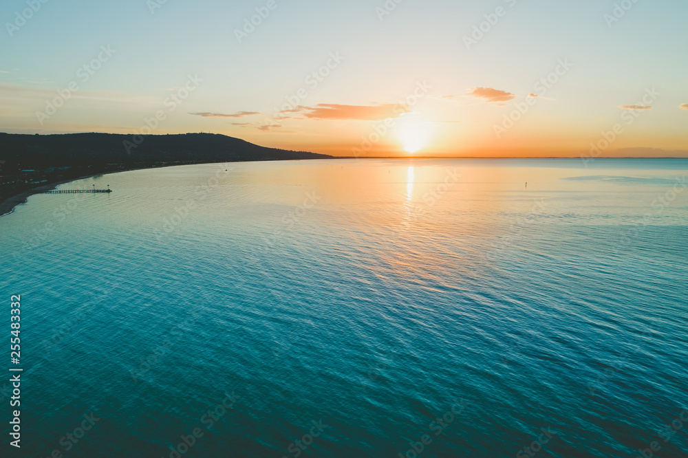 Aerial view of scenic sunset over ocean coastline