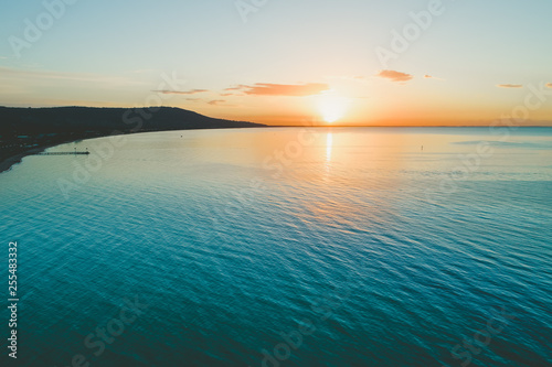 Aerial view of scenic sunset over ocean coastline