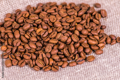 Coffee beans on cloth © Danil Bukharov