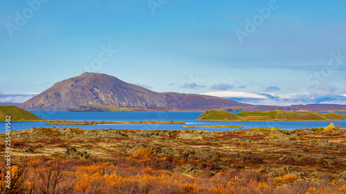 Myvatn lake in Northern Iceland. Islet of volcanic pseudo crater is a middle. Landscape of Myvatn lake in Northern Iceland