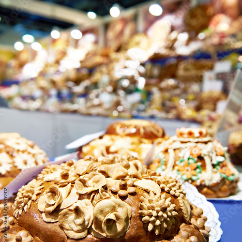 Bread loafs Korovai with patterns in pastry shop