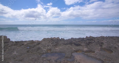Waves Rolling in Behind Volcanic Rock in Hawaii