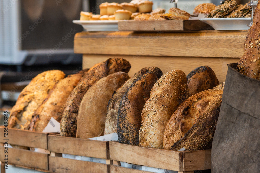 variety of bread on a stand of a bakery
