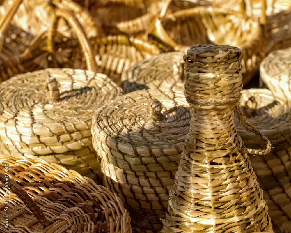 woven straw containers. wicker baskets handmade on the market.