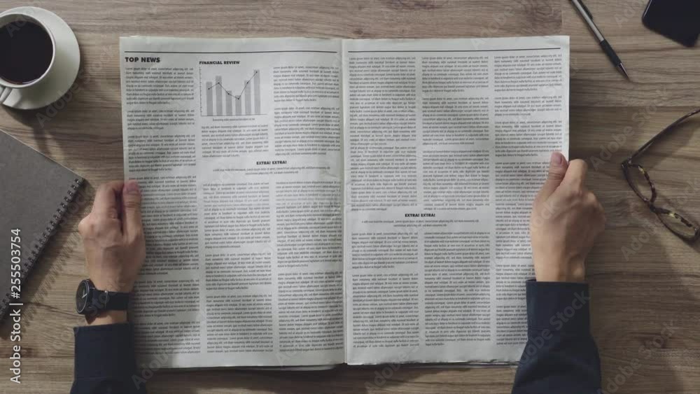 Business man reading the Newspaper on wooden table in the room on the morning, Daily Newspaper mock-up concept