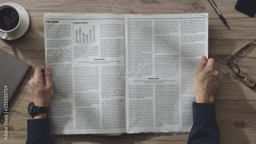 Business man reading the Newspaper on wooden table in the room on the morning, Daily Newspaper mock-up concept