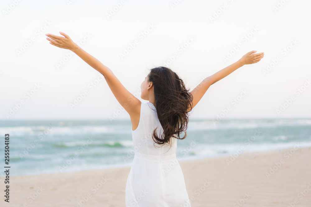 Portrait beautiful young asian woman happy and smile on the beach sea and ocean Portrait beautiful young asian woman happy and smile on the beach sea and ocean