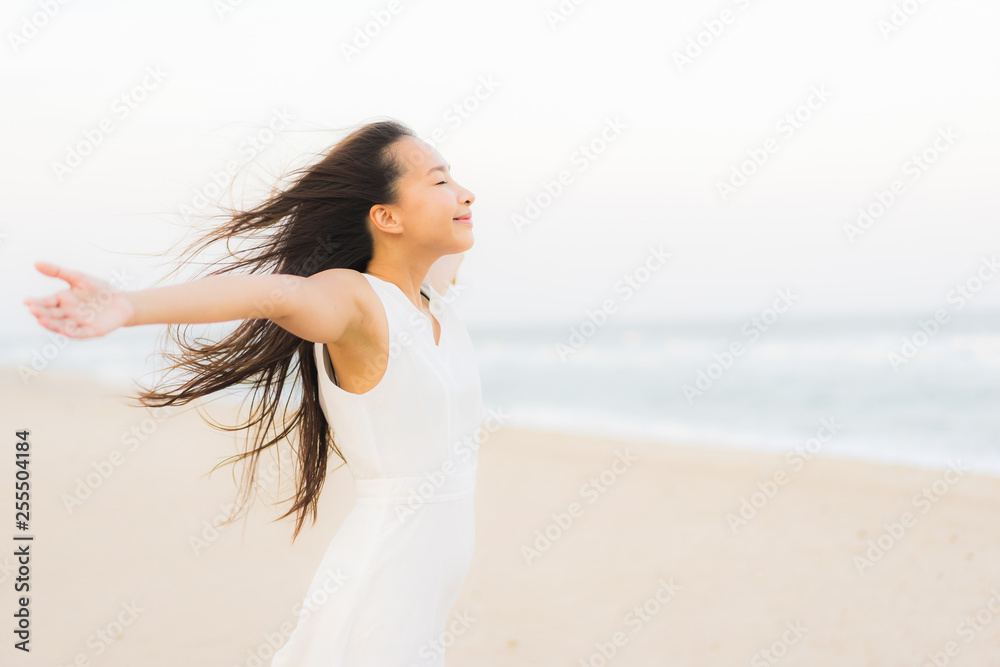 Portrait beautiful young asian woman happy and smile on the beach sea and ocean Portrait beautiful young asian woman happy and smile on the beach sea and ocean