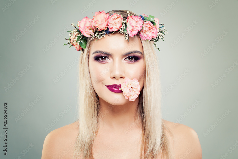 Floral blossom portrait of beautiful woman with perfect makeup and flowers