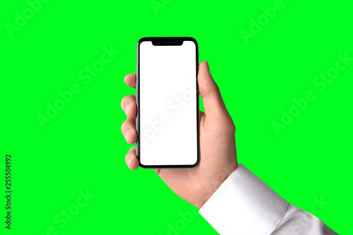Business man holding modern smartphone, blank screen, greenscreen background template, isolated