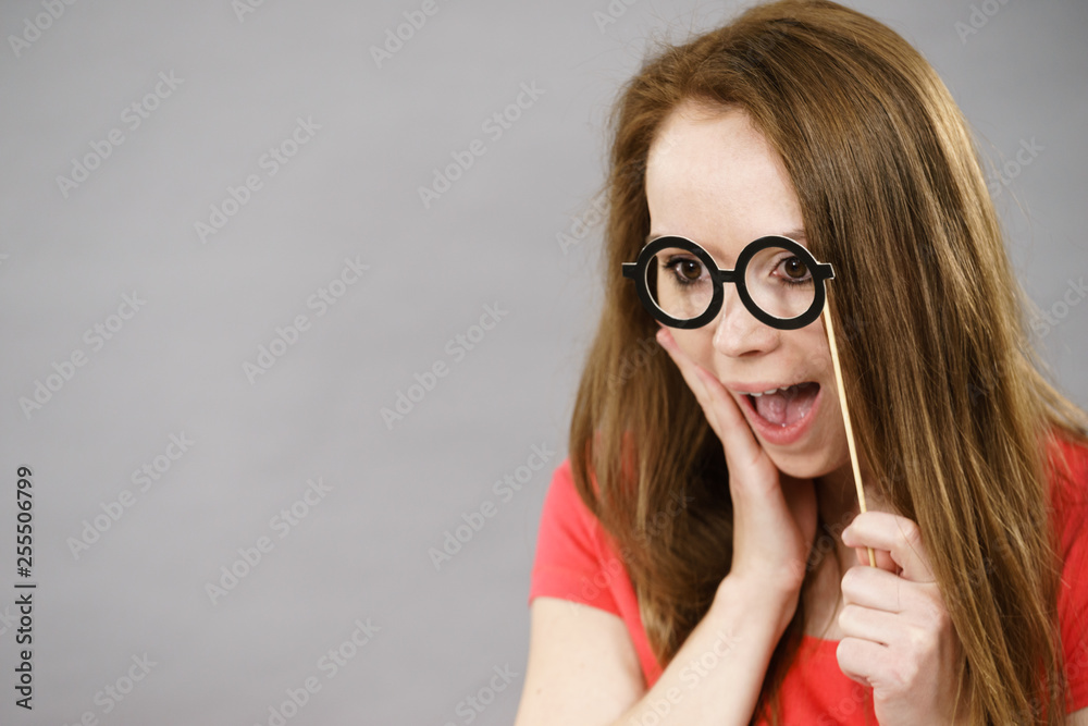Shocked woman with fake eyeglasses screaming Shocked woman with fake eyeglasses screaming