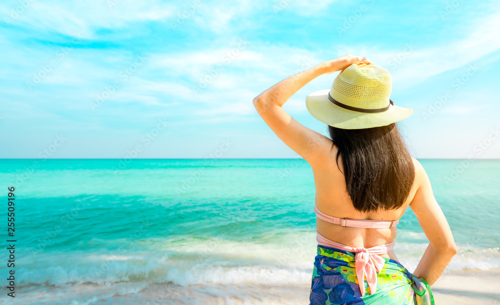 young Asian woman with straw hat relax 
