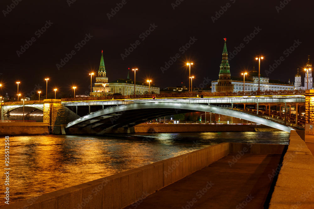 Bolshoy Kamenny Bridge with illumination over Moskva river at night. View from Sofiyskaya Embankment