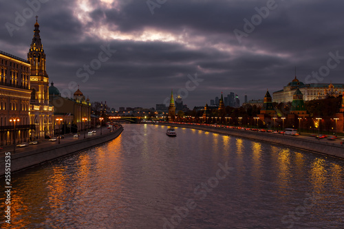 Moskva river near Moscow Kremlin in evening against dramatic cloudy sky. Urban landscape