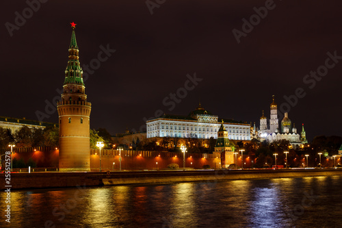 View of towers of Moscow Kremlin and Grand Kremlin Palace with cathedrals at night with illumination