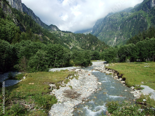 The Chärstelenbach stream in the Maderanertal alpine valley - Canton of Uri, Switzerland photo