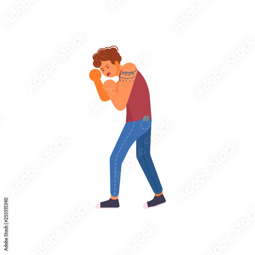 Young man defending himself with hands up. 