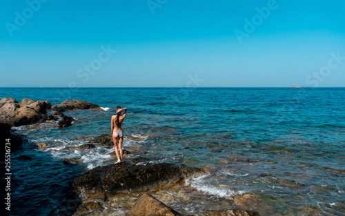 Sexy young woman in the ocean posing © ponomarencko