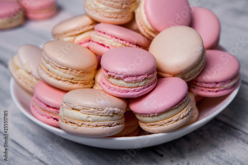 Close up colorful macarons dessert with vintage pastel tones French colorful macarons background, close up macaron or macaroons cookie, tasty dessert. food background